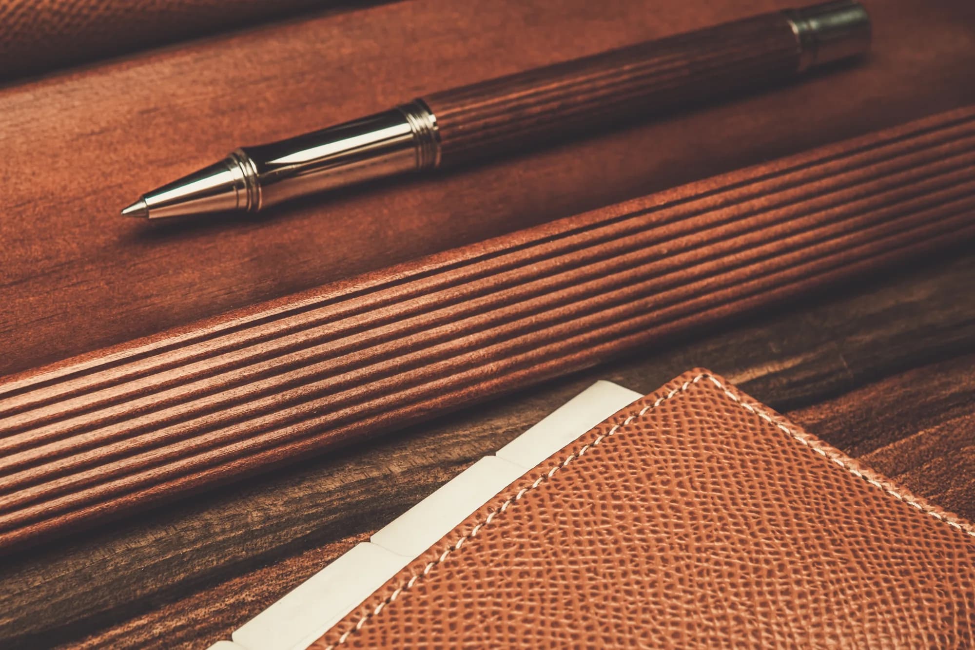 Pen and notebook on a desk